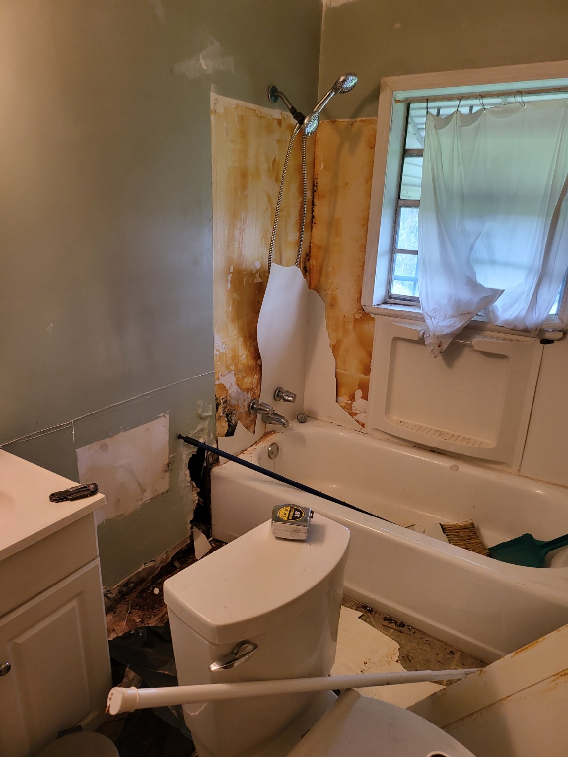 Another view of the tub and wall during renovation