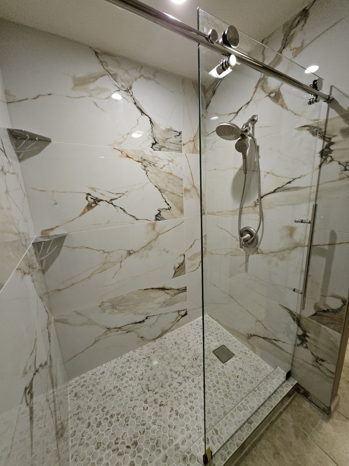 Close view of the finished shower wall and dual shower heads