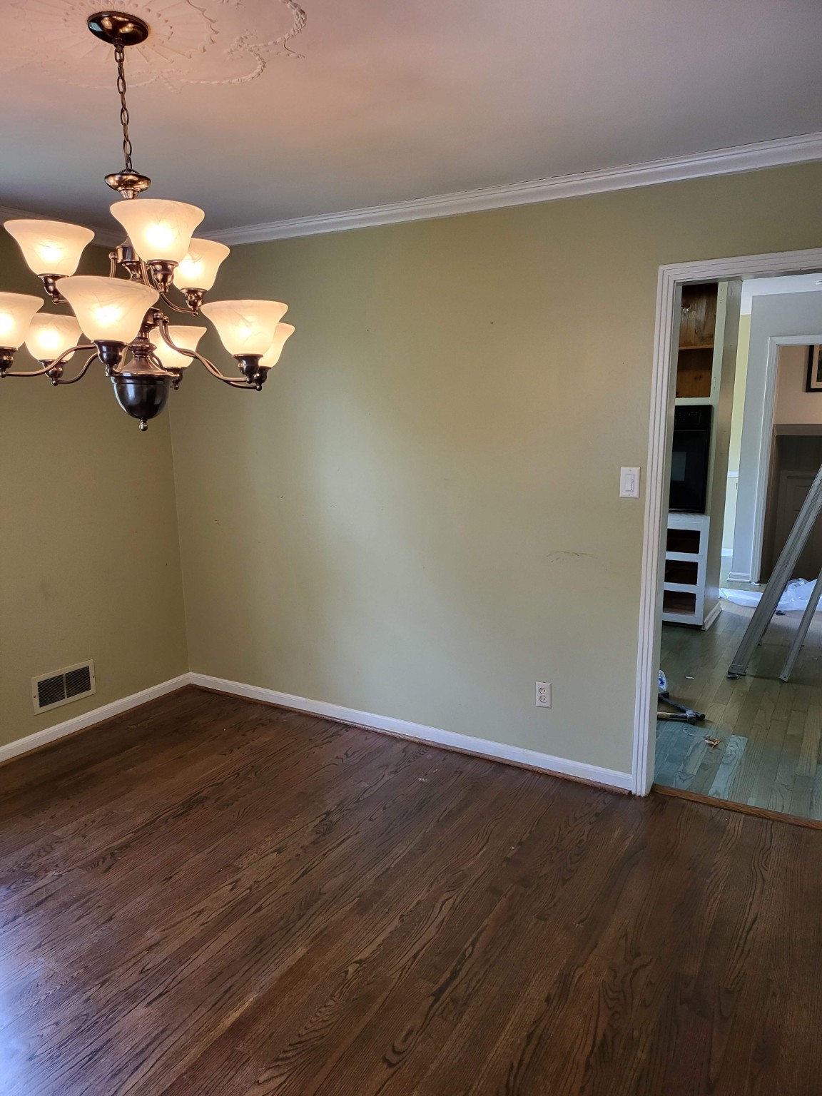 Original dining room wall and doorway before the kitchen remodel