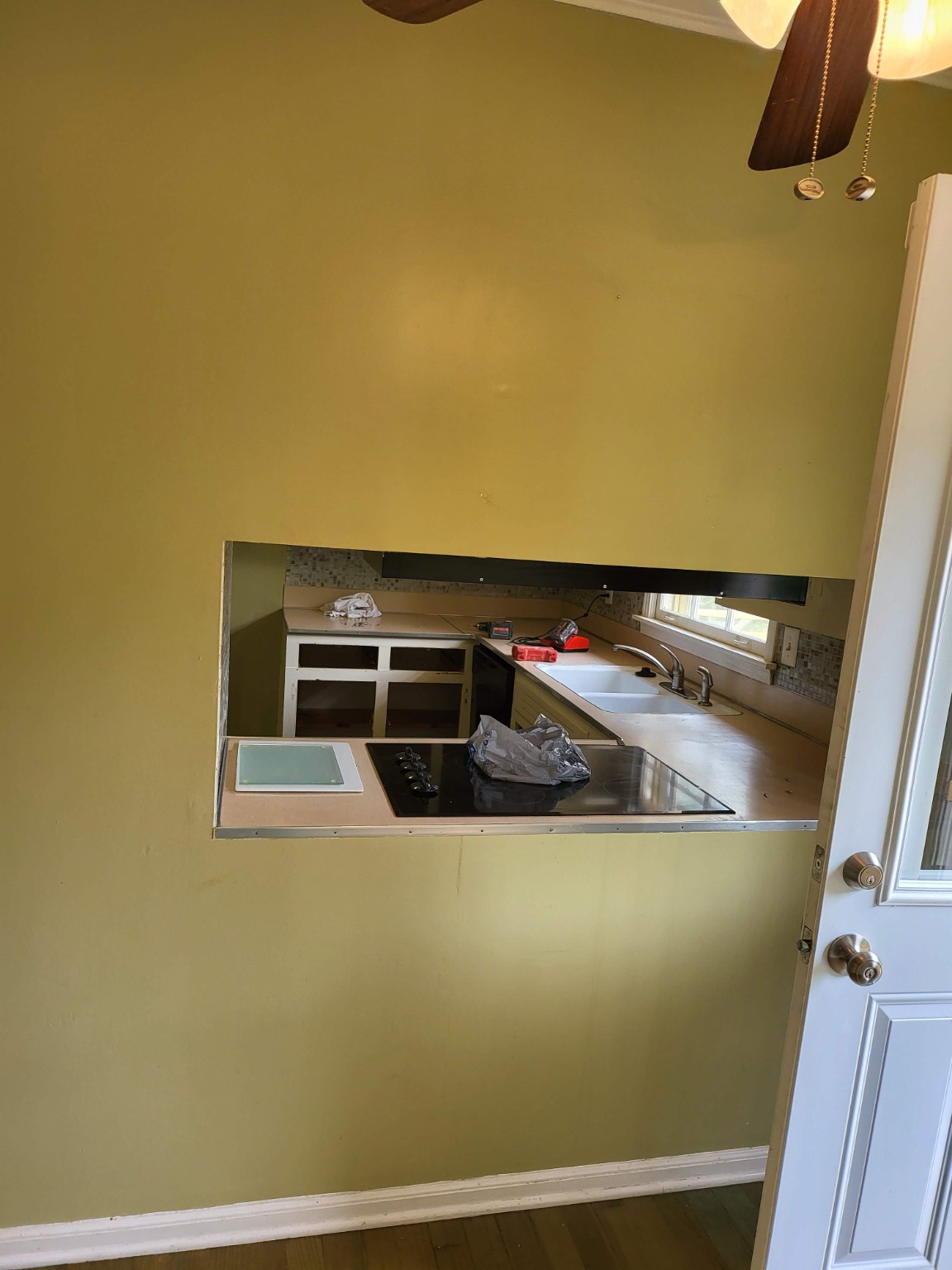 Original pass-through opening between the kitchen and dining room