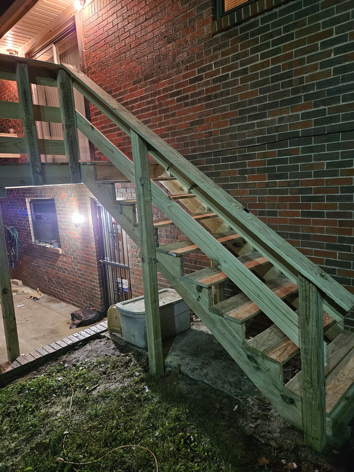 Side view of new raised deck stairs and railing
