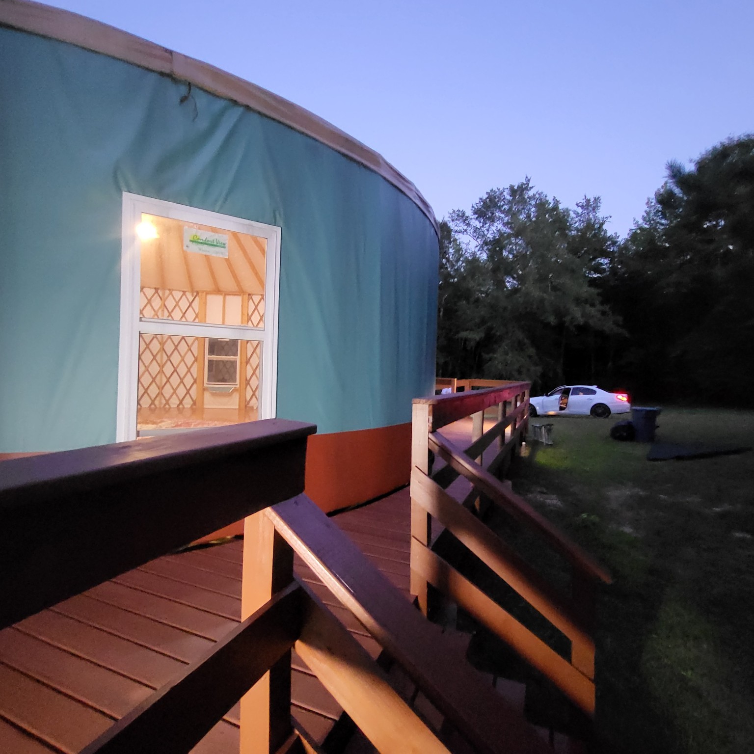Yurt exterior with side deck and railing